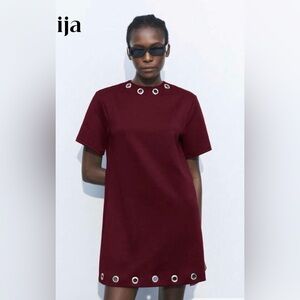 NIP Shift dress with grommet design on collar and bottom. Loose fit. ❤️❤️